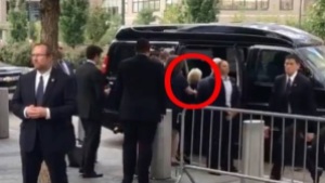 hillary-shoved-into-van-face-down